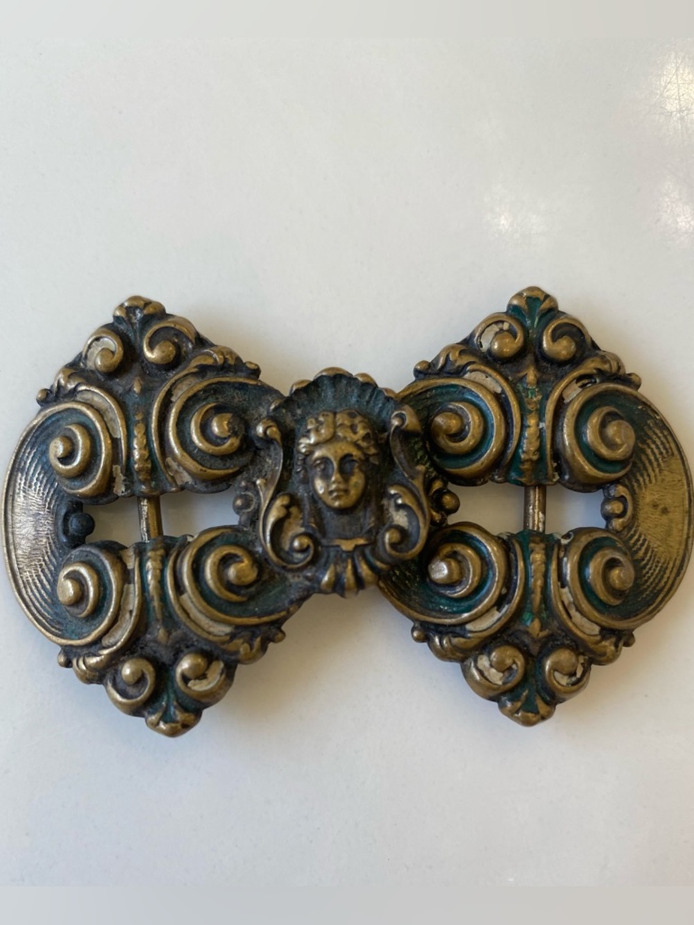 Ornate Belt Buckle with Cherub Motif